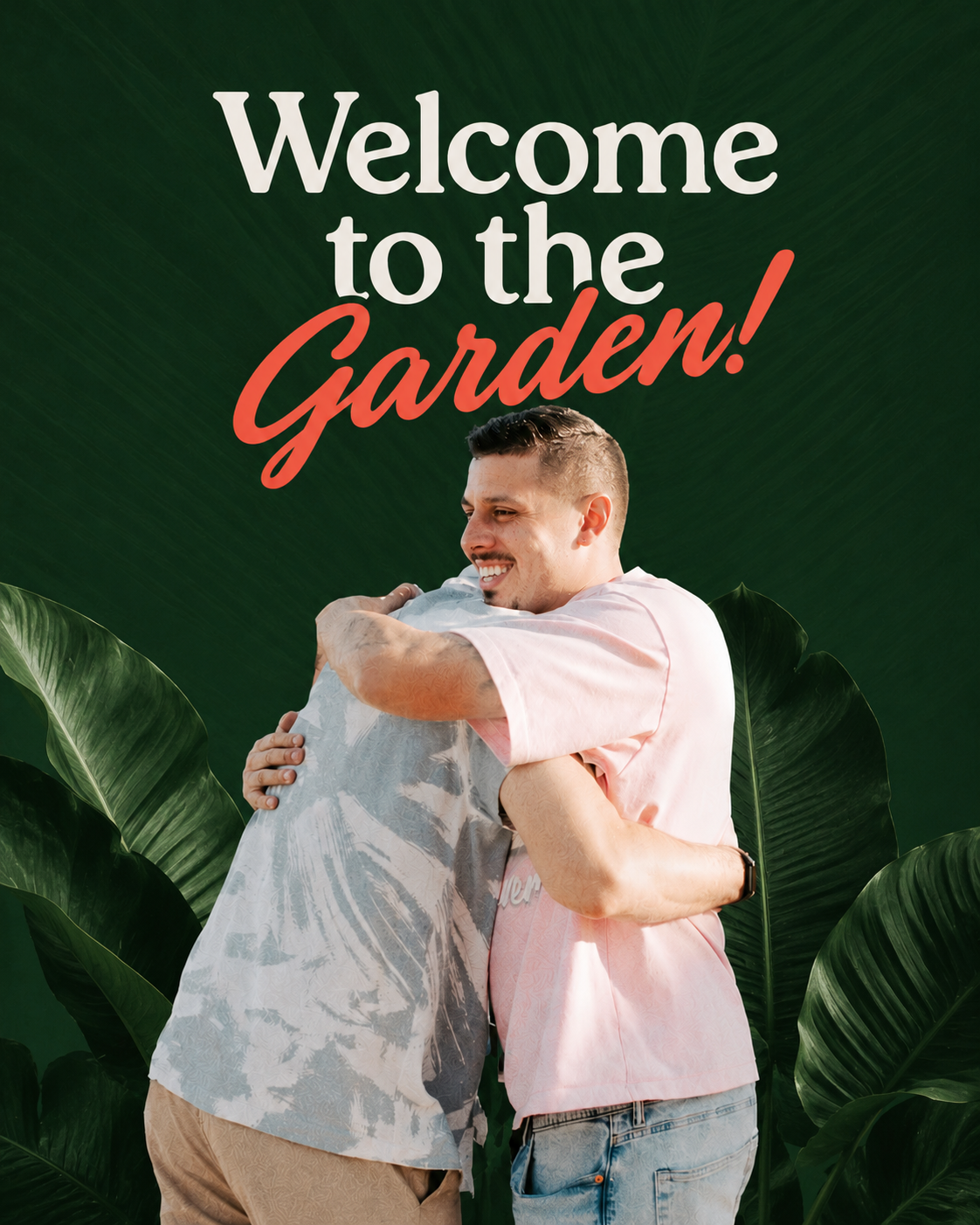 Two men embracing in a warm welcome, framed by tropical garden leaves